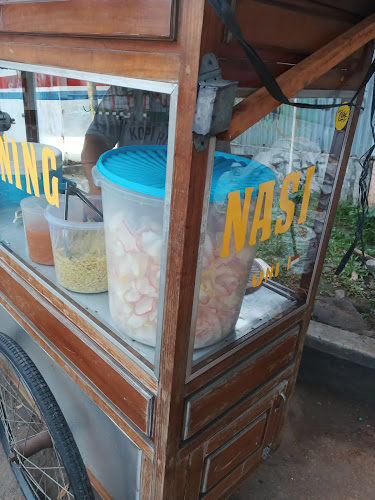 Nasi Kuning Depan Pom Bensin - Gastronomi dan perhotelan